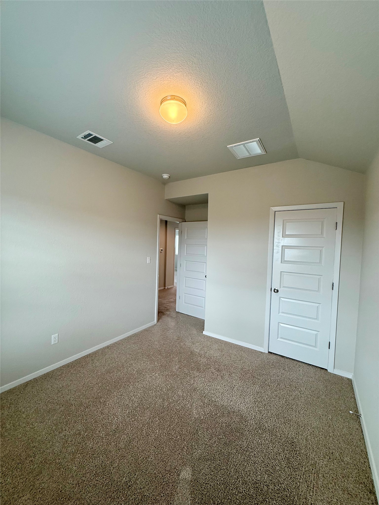 212 Lake Placid Run Elgin, TX 78621 - Photo 23 of 27 A spacious, naturally illuminated room featuring warm carpet and fresh paint, awaiting your personal touch.