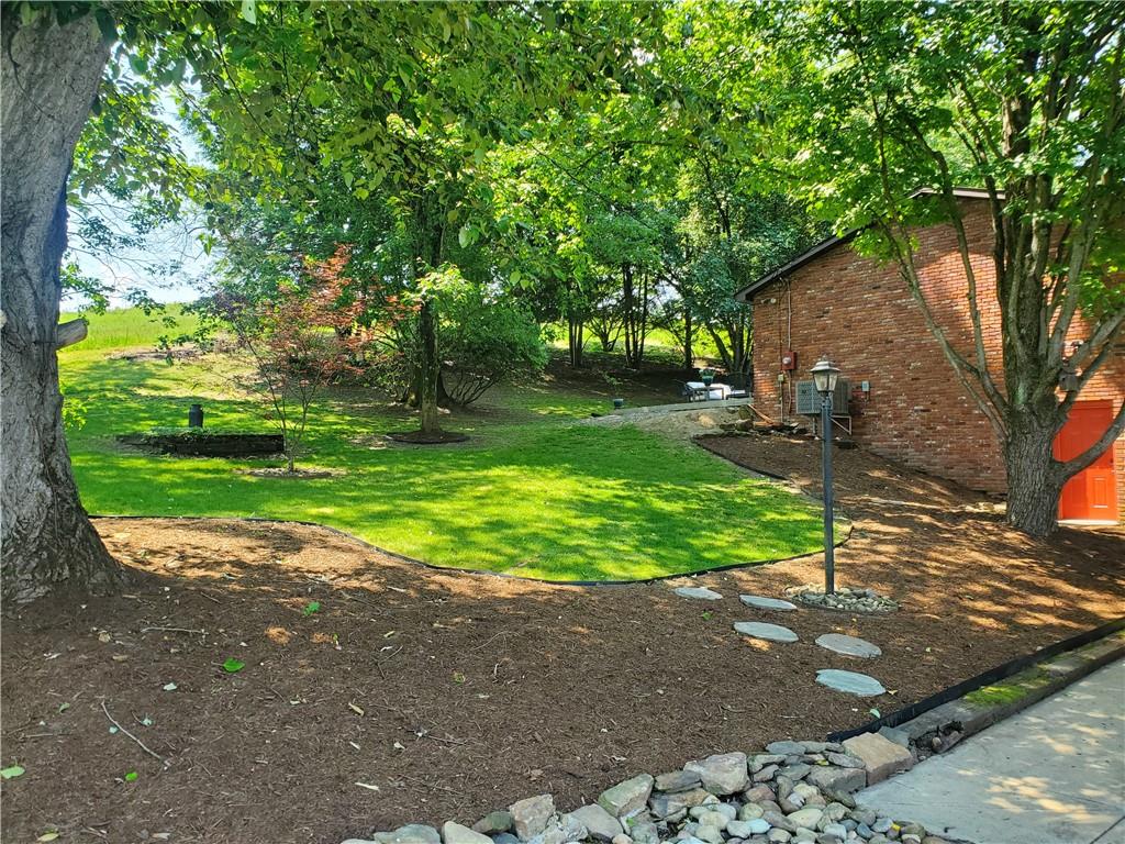 132 Hi Acres Road Greensburg, PA 15601 - Photo 37 of 45 a view of a backyard with large tree