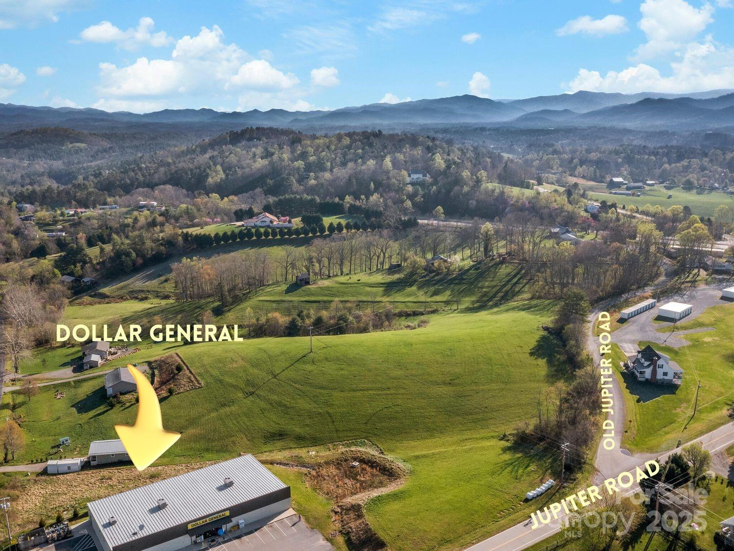99999 Sprouse Town Road Weaverville, NC 28787 - Photo 3 of 20 a view of a lake with a mountain in the background
