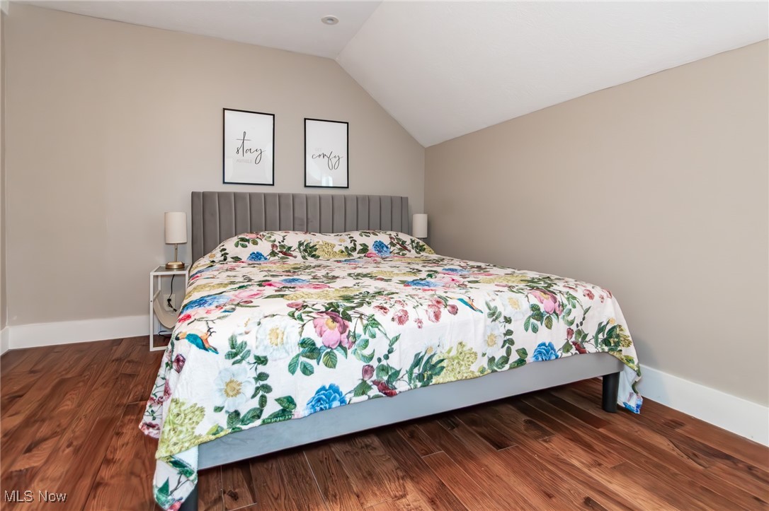 7806 Fairidge Road Willoughby, OH 44094 - Photo 30 of 41 Bedroom featuring vaulted ceiling and wood finished floors