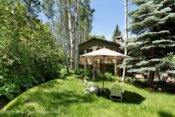 a view of a garden with an outdoor seating