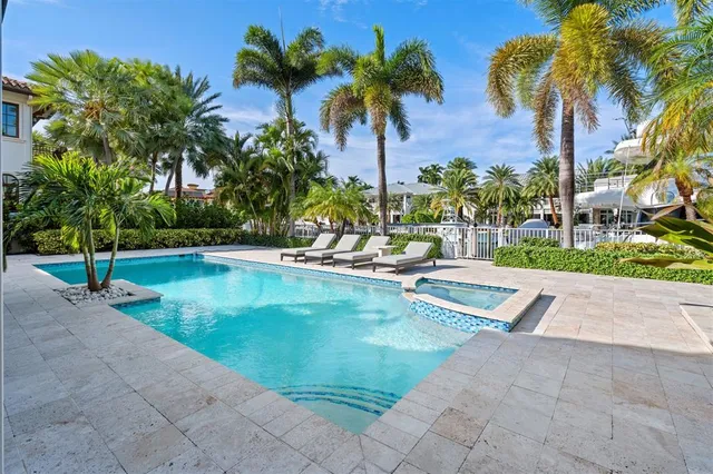 a view of a swimming pool with a sitting area