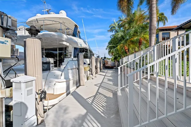 a view of a patio with couches table and chairs and potted plants
