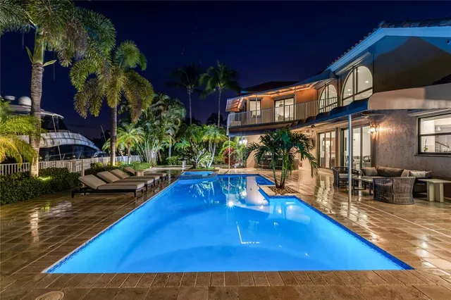 a view of a swimming pool with a patio