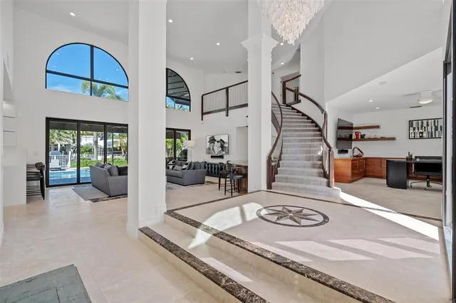 a view of a living room and entryway