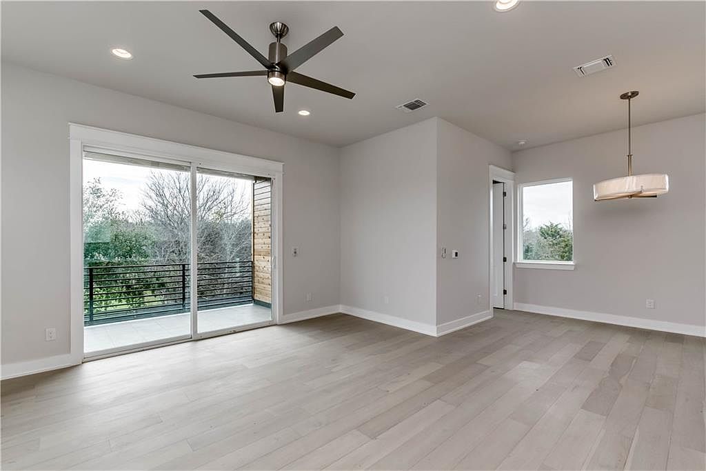 5002 Pecan Springs Road, Unit 10 Austin, TX 78723 - Photo 7 of 29 Unfurnished room with recessed lighting, wood finished floors, visible vents, and ceiling fan