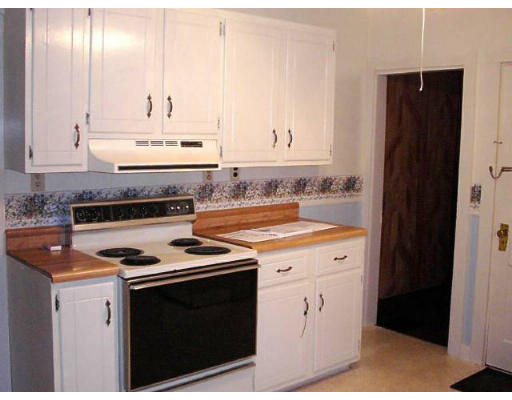34 Ruggles Street Three Rivers, MA 01080 - Photo 3 of 10 a kitchen with stainless steel appliances a stove a refrigerator and a sink