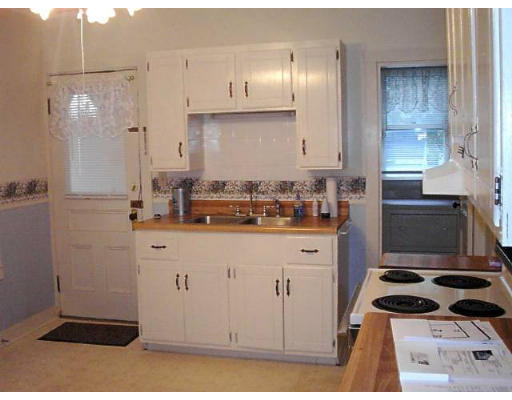 34 Ruggles Street Three Rivers, MA 01080 - Photo 4 of 10 a kitchen with stainless steel appliances granite countertop a sink stove and refrigerator