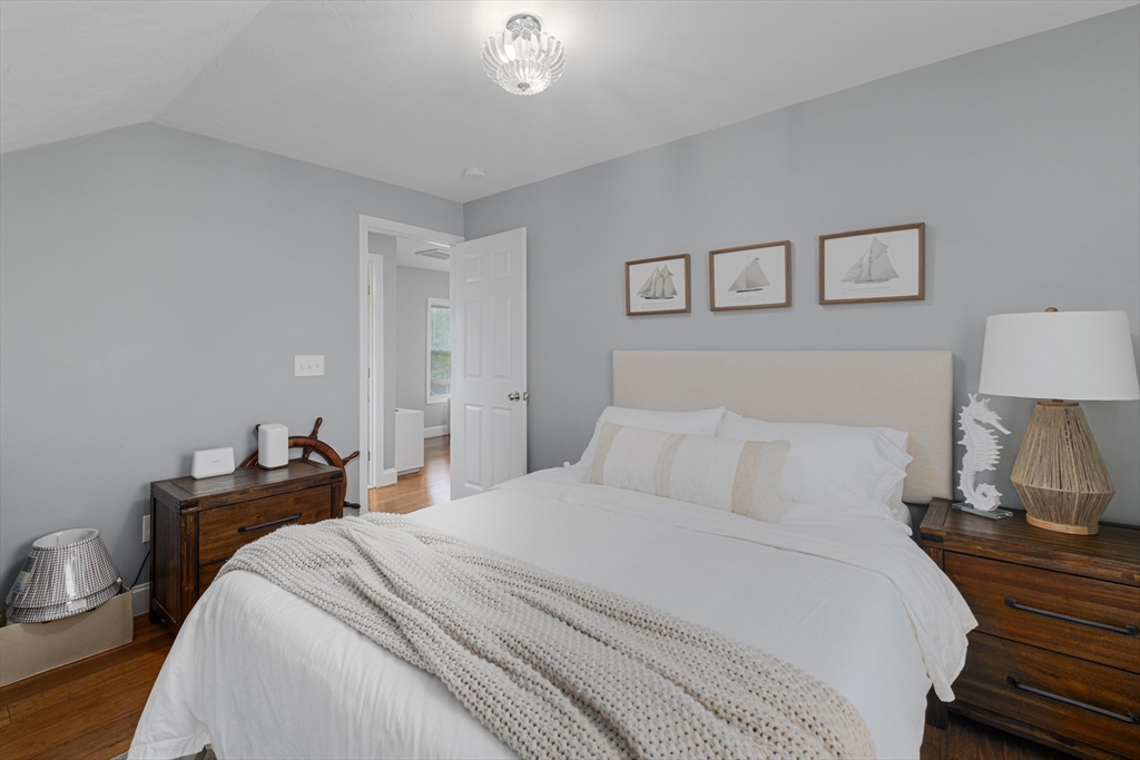 69 Denver Street Fall River, MA 02721 - Photo 29 of 35 a bedroom with a bed and a lamp