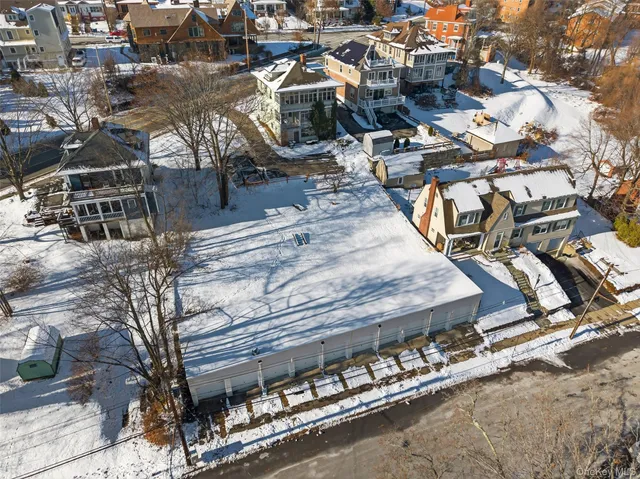 a view of a backyard with seating area