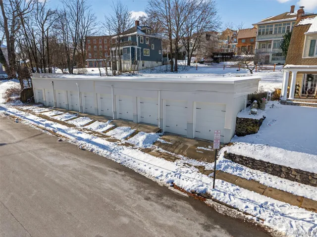 a view of a backyard patio and covered with snow