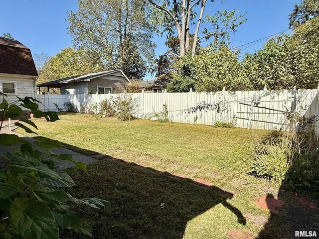 front view of a house with a tree