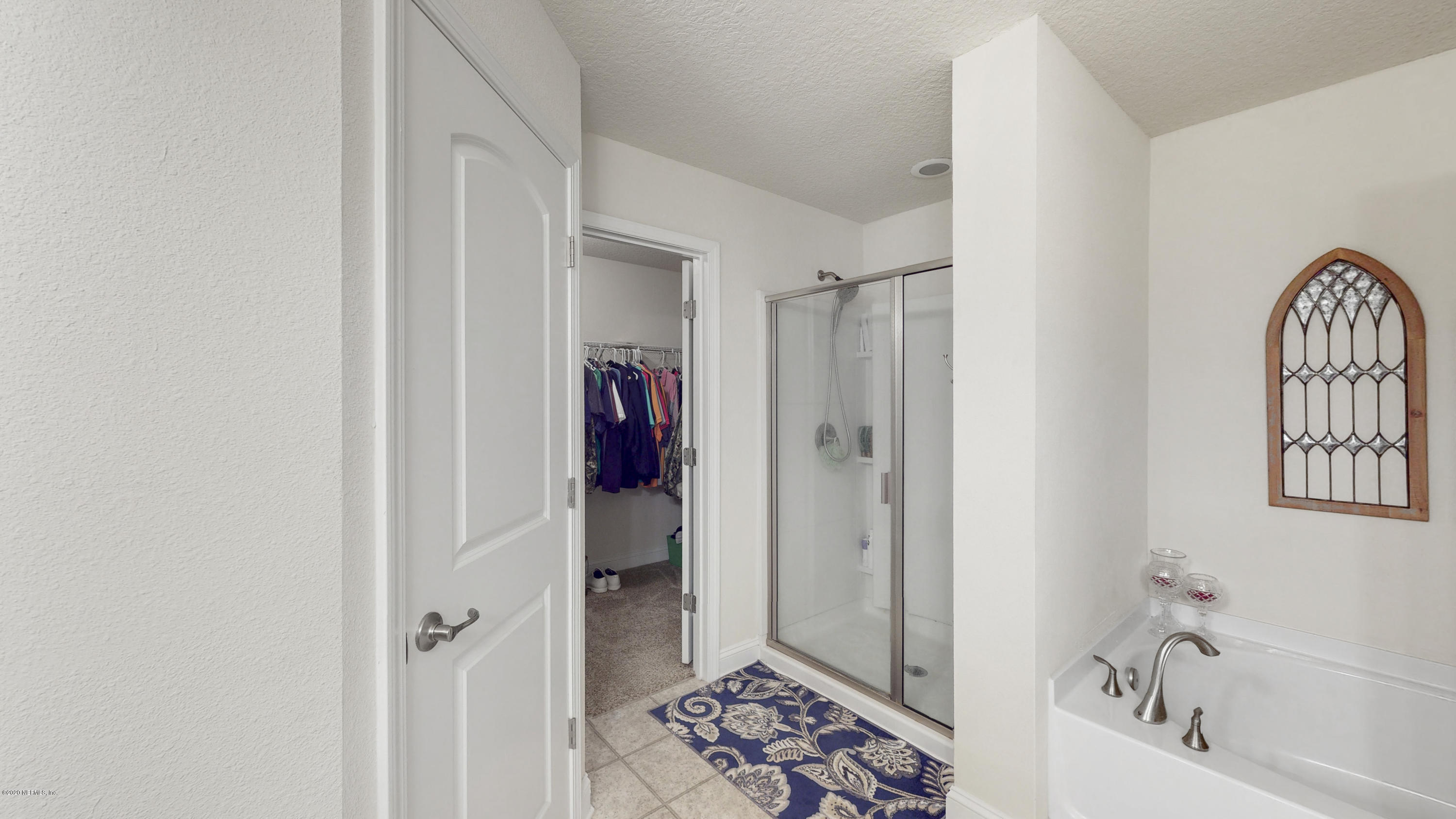 88101 Maybourne Road Yulee, FL 32097 - Photo 15 of 22 a view of bathroom with bathtub and shower
