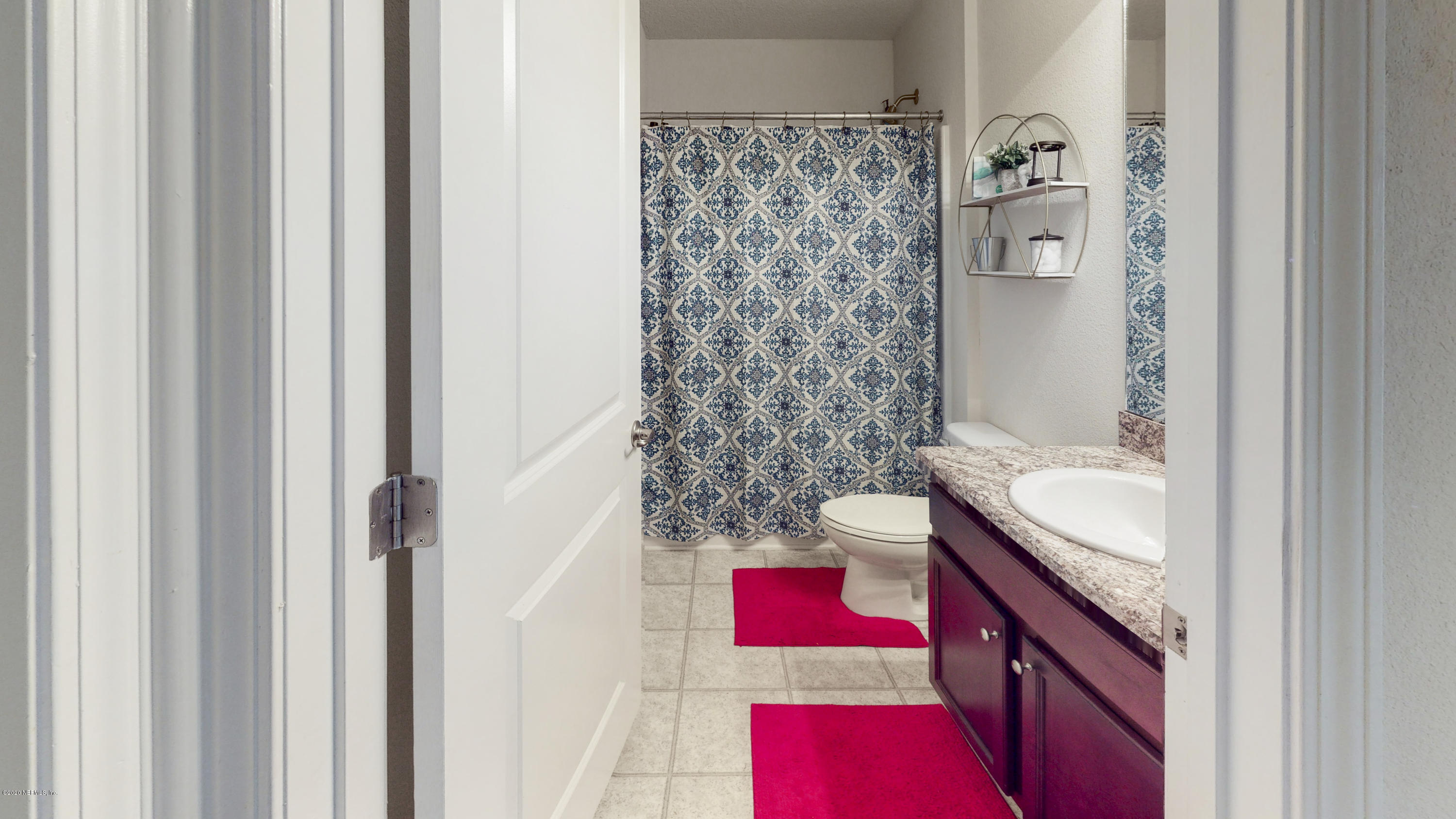 88101 Maybourne Road Yulee, FL 32097 - Photo 21 of 22 a bathroom with a sink and a mirror