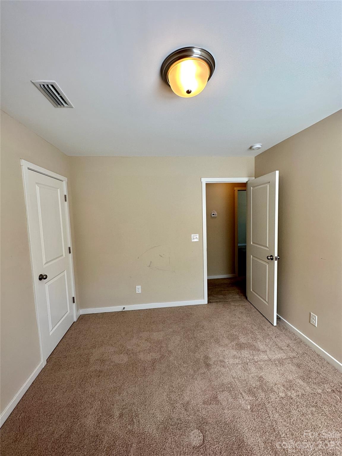 5513 Idlewild Road North Charlotte, NC 28227 - Photo 11 of 18 a view of an empty room with a window