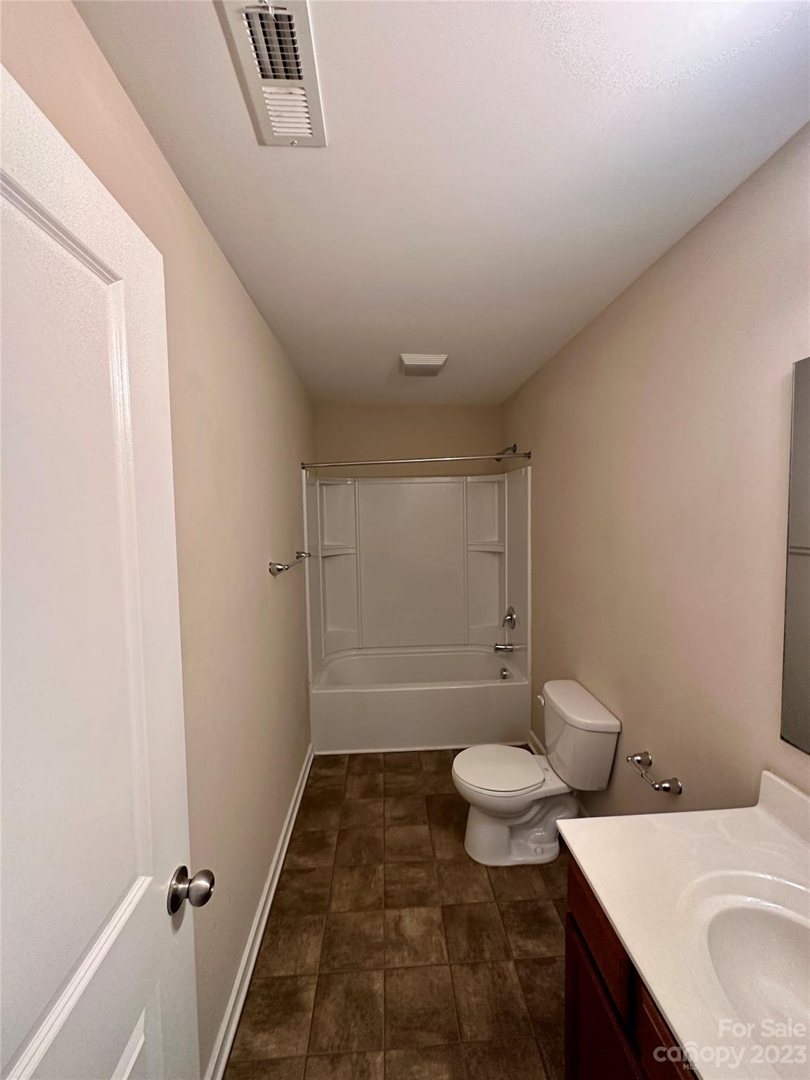 5513 Idlewild Road North Charlotte, NC 28227 - Photo 12 of 18 a bathroom with a sink a toilet and shower