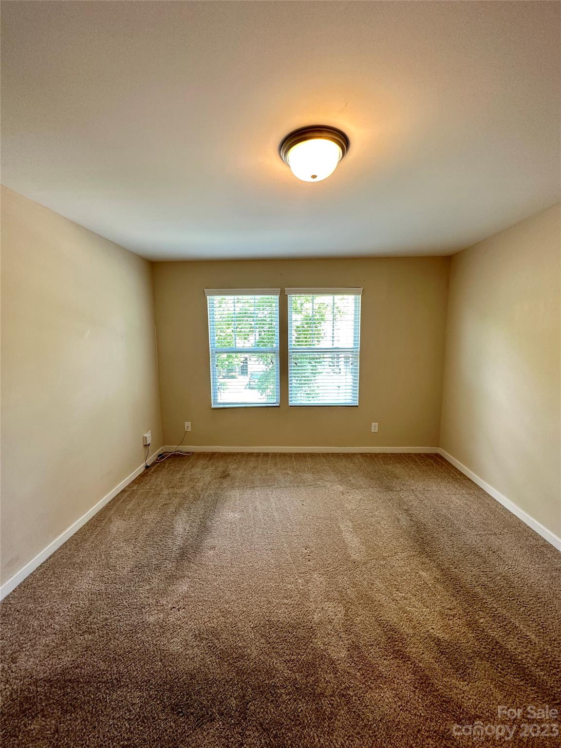 5513 Idlewild Road North Charlotte, NC 28227 - Photo 13 of 18 an empty room with a window