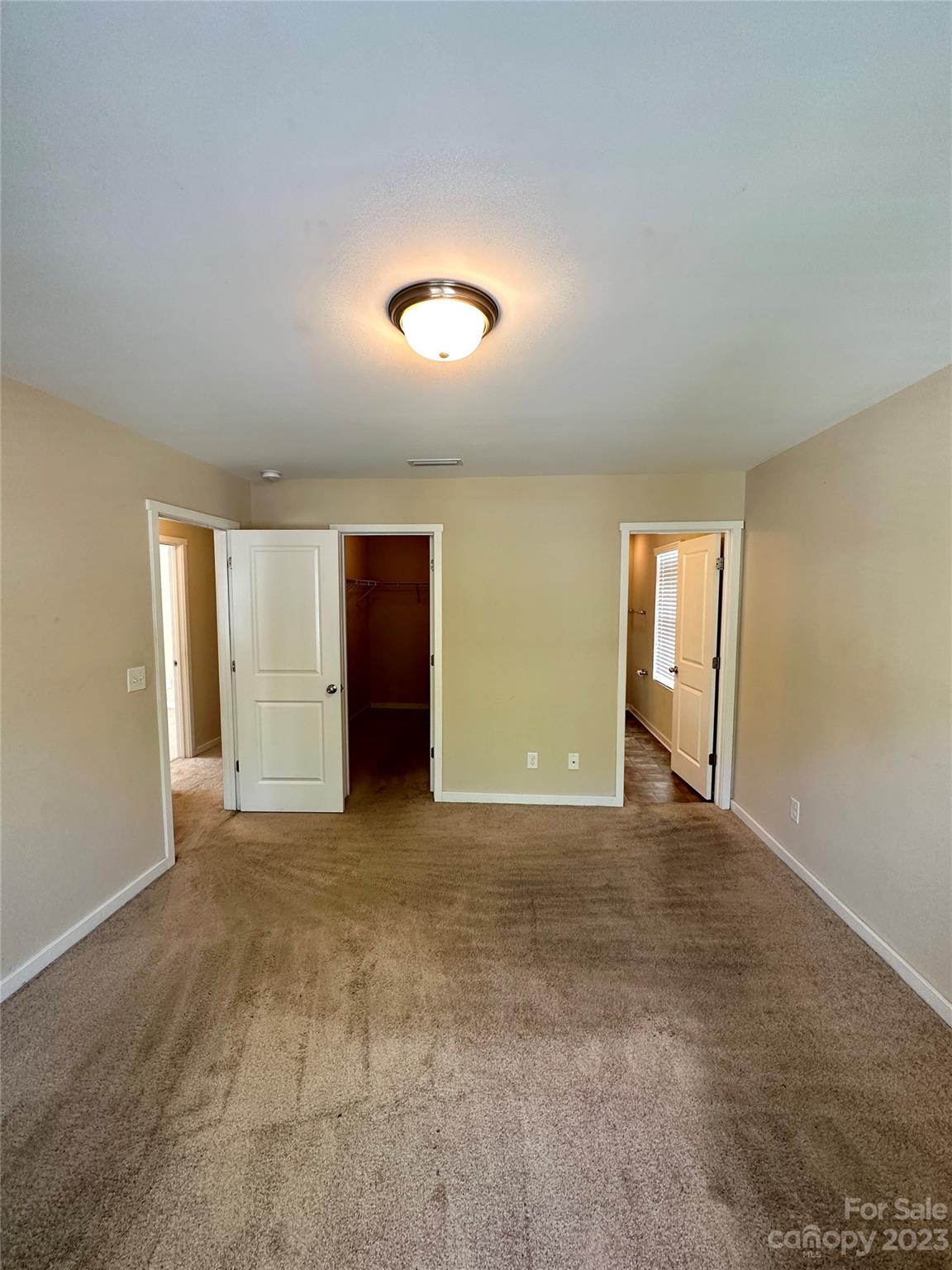 5513 Idlewild Road North Charlotte, NC 28227 - Photo 14 of 18 an empty room with windows and closet