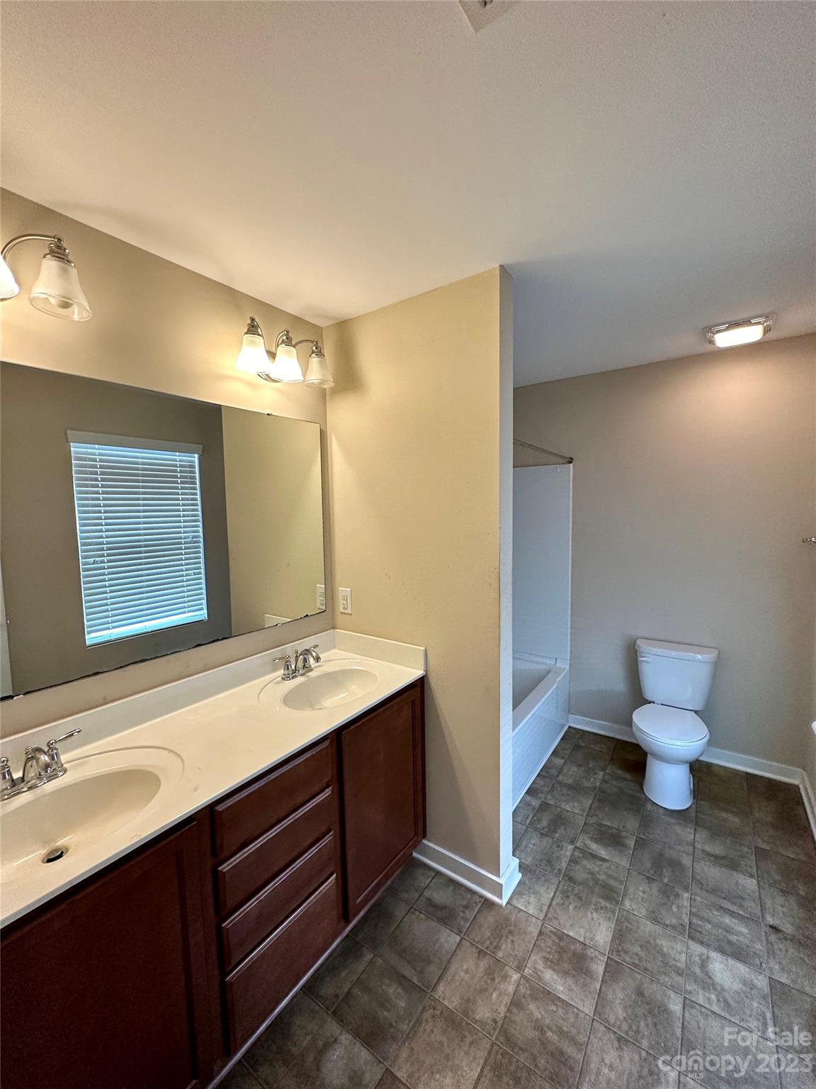 5513 Idlewild Road North Charlotte, NC 28227 - Photo 15 of 18 a bathroom with a sink and a mirror
