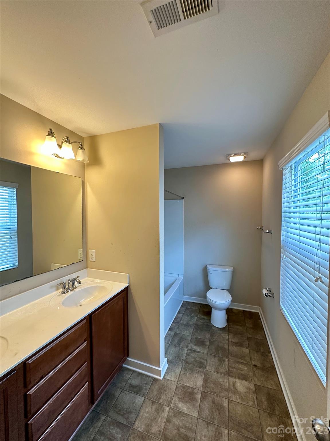 5513 Idlewild Road North Charlotte, NC 28227 - Photo 16 of 18 a bathroom with a sink and a mirror