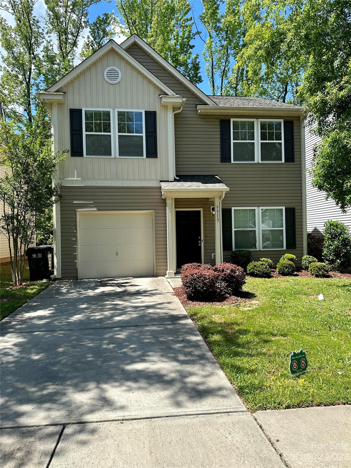5513 Idlewild Road North Charlotte, NC 28227 - Photo 2 of 18 a front view of a house with garden