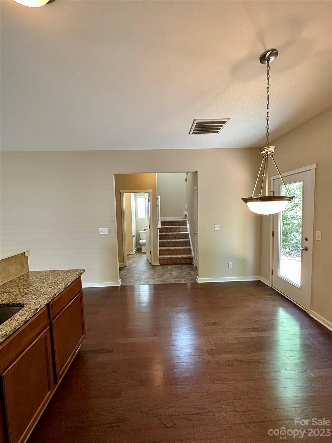 5513 Idlewild Road North Charlotte, NC 28227 - Photo 6 of 18 a view of empty room with wooden floor