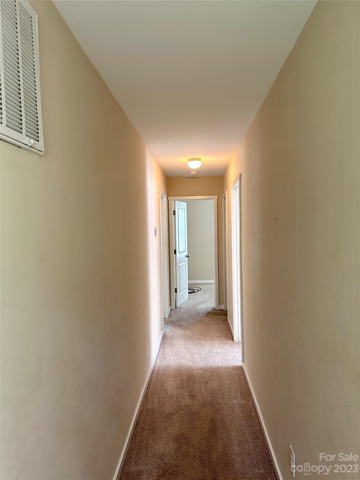 5513 Idlewild Road North Charlotte, NC 28227 - Photo 9 of 18 a view of a hallway with wooden floor