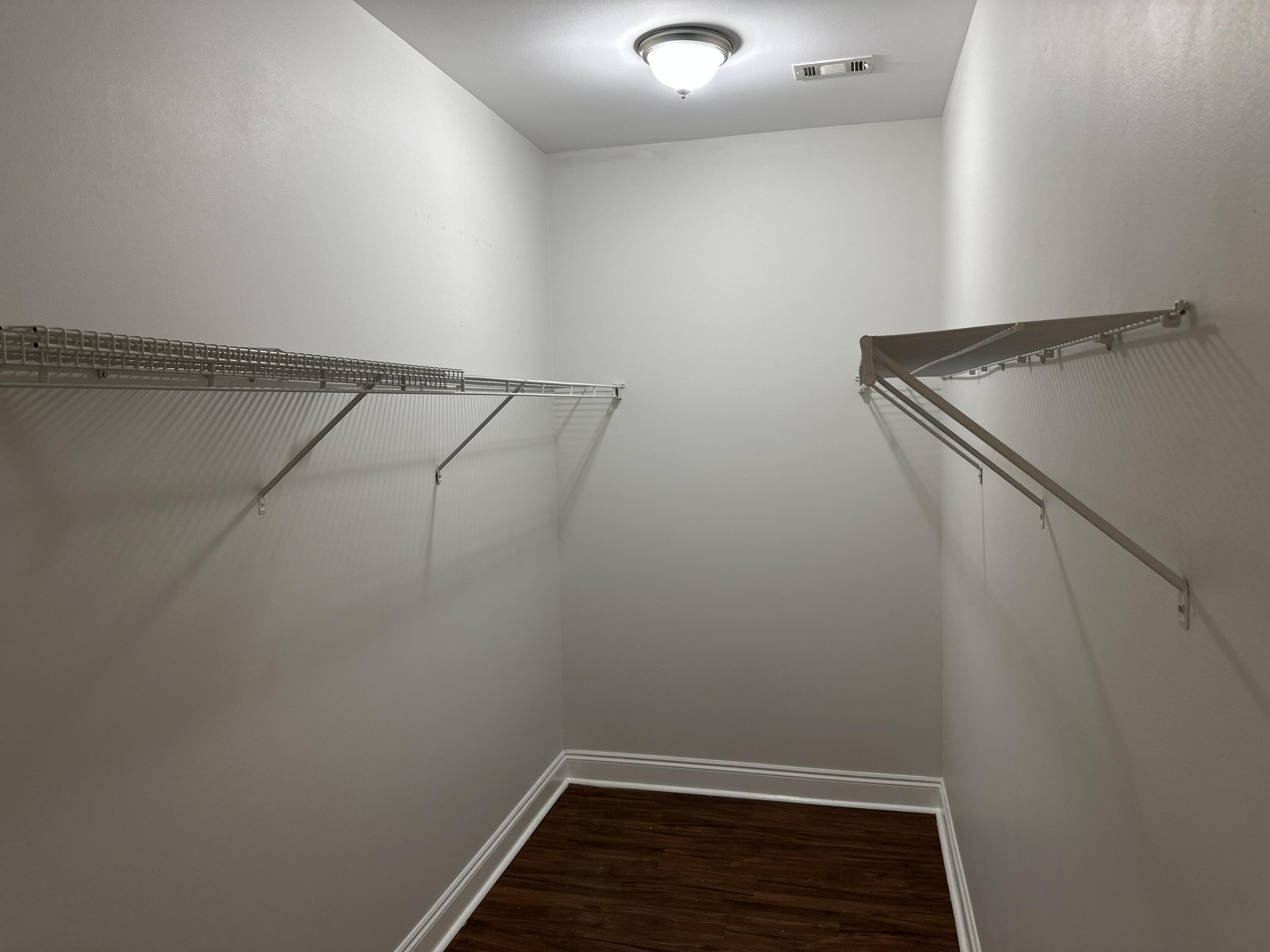 261 County Line Road Niceville, FL 32578 - Photo 8 of 17 a view of an empty walk in closet