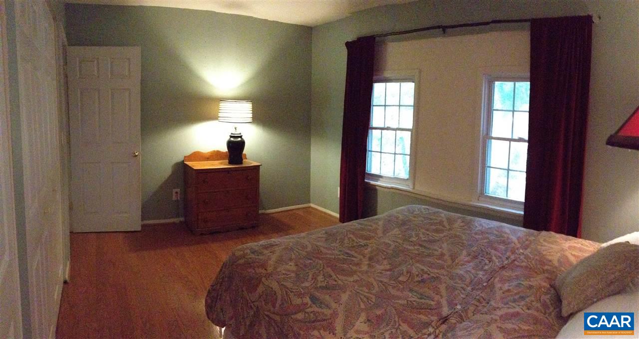 409A Valley Rd Extension Charlottesville, VA 22903 - Photo 11 of 22 a bedroom with a bed and window