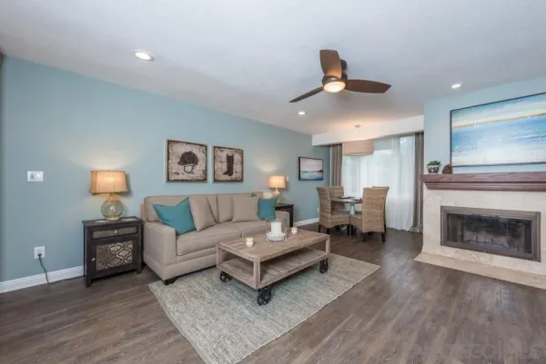 a living room with furniture and a fireplace