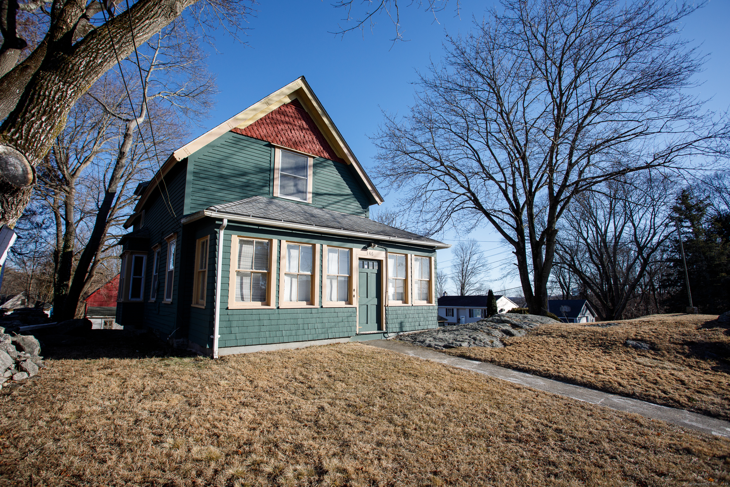 a front view of a house with a yard