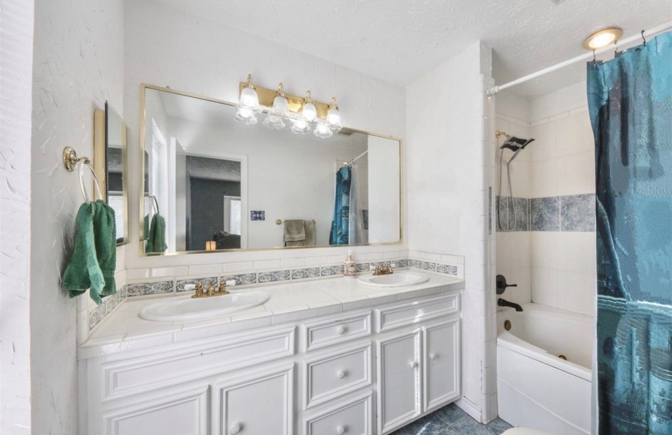 17314 Edenbridge Court Spring, TX 77379 - Photo 19 of 33 a bathroom with a tub sink and mirror