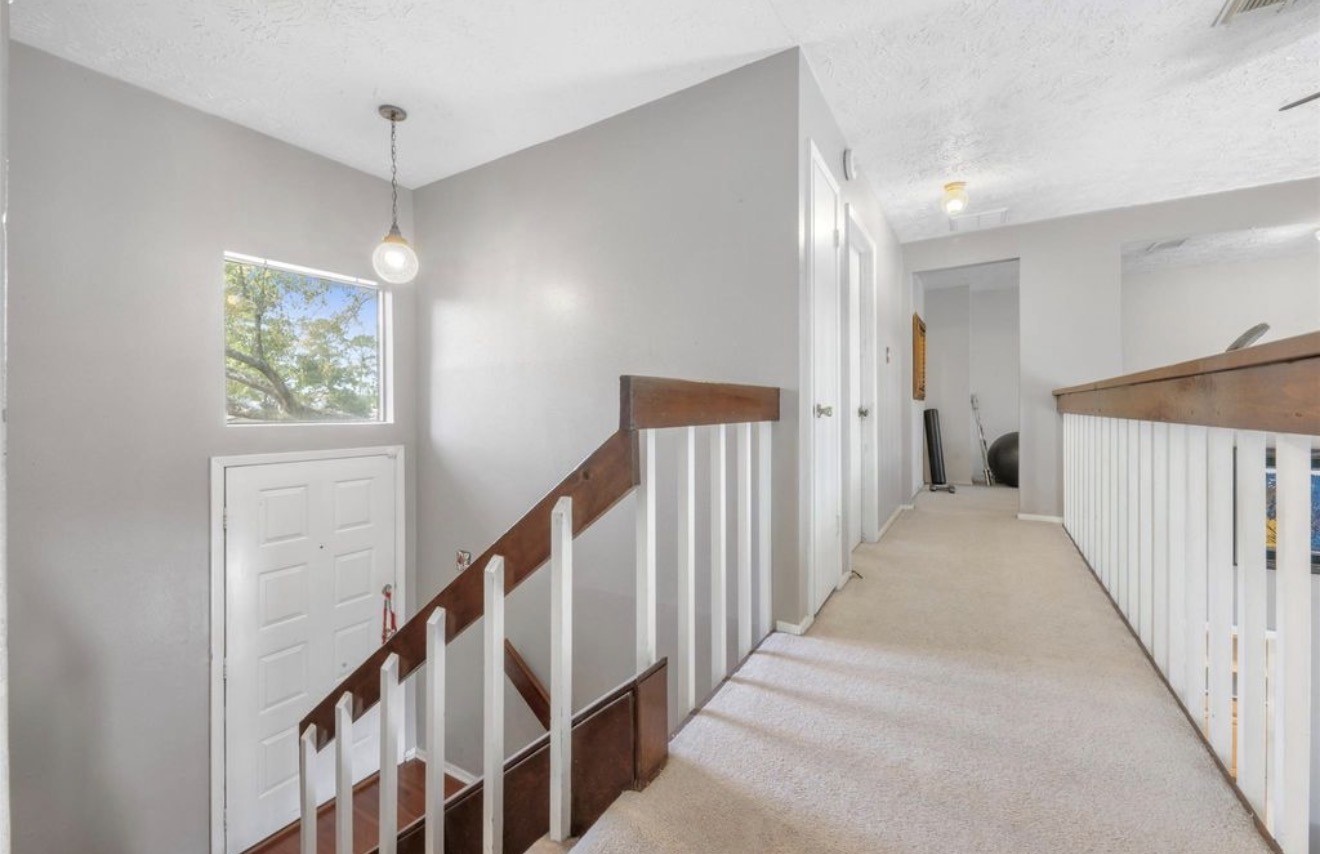 17314 Edenbridge Court Spring, TX 77379 - Photo 20 of 33 a view of a hallway with stairs