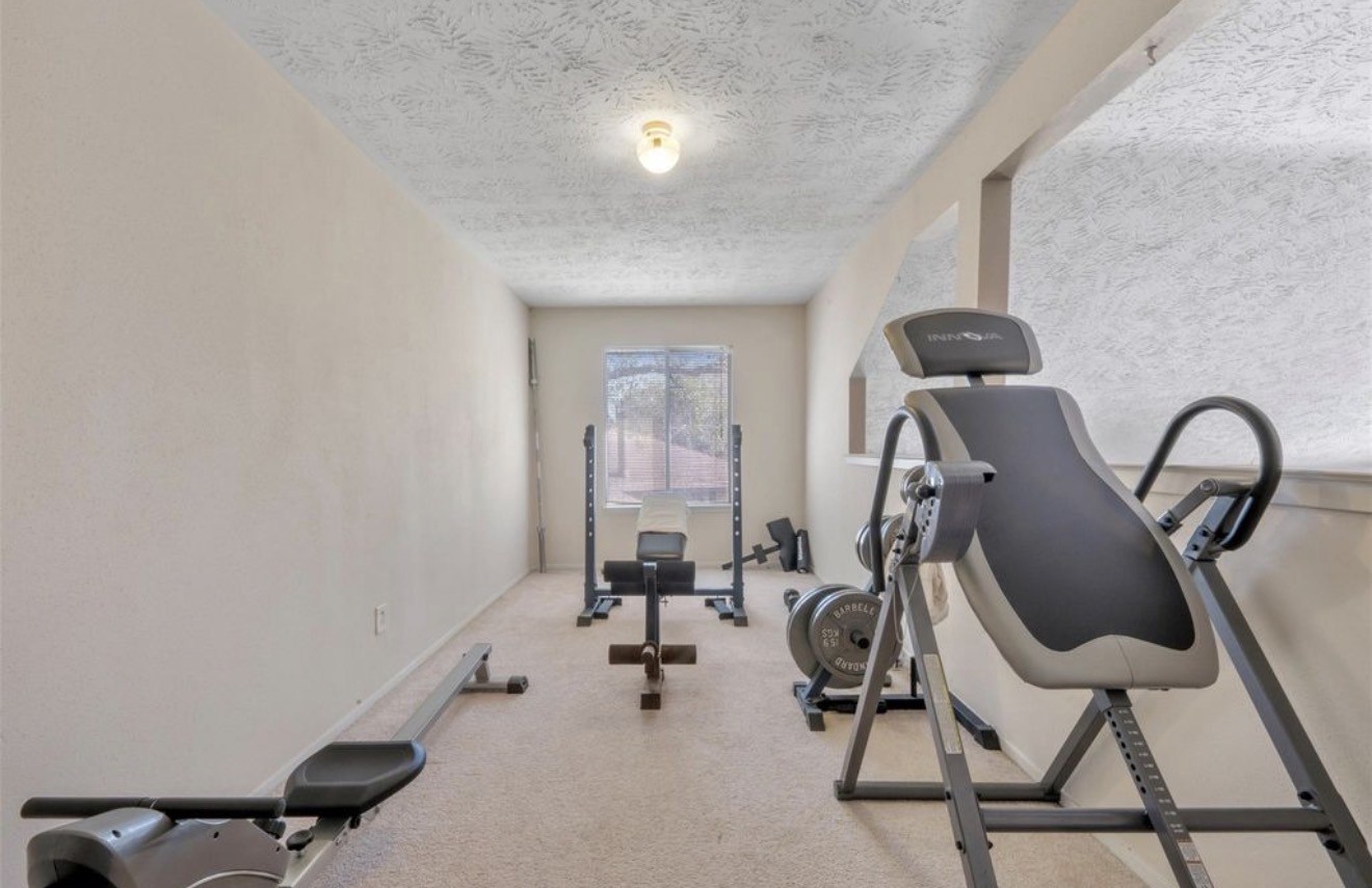 17314 Edenbridge Court Spring, TX 77379 - Photo 21 of 33 a view of a room with gym equipment