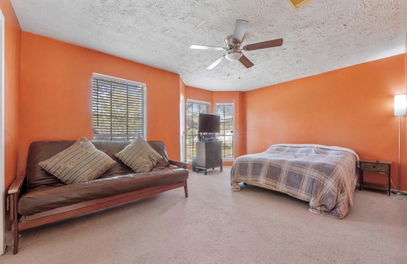17314 Edenbridge Court Spring, TX 77379 - Photo 26 of 33 a bedroom with a bed couch and window