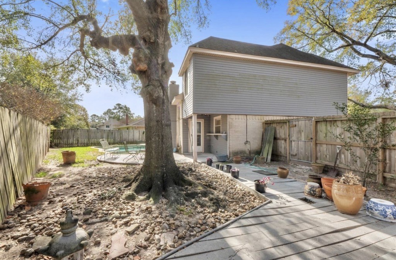 17314 Edenbridge Court Spring, TX 77379 - Photo 30 of 33 a view of a house with backyard sitting area and tub