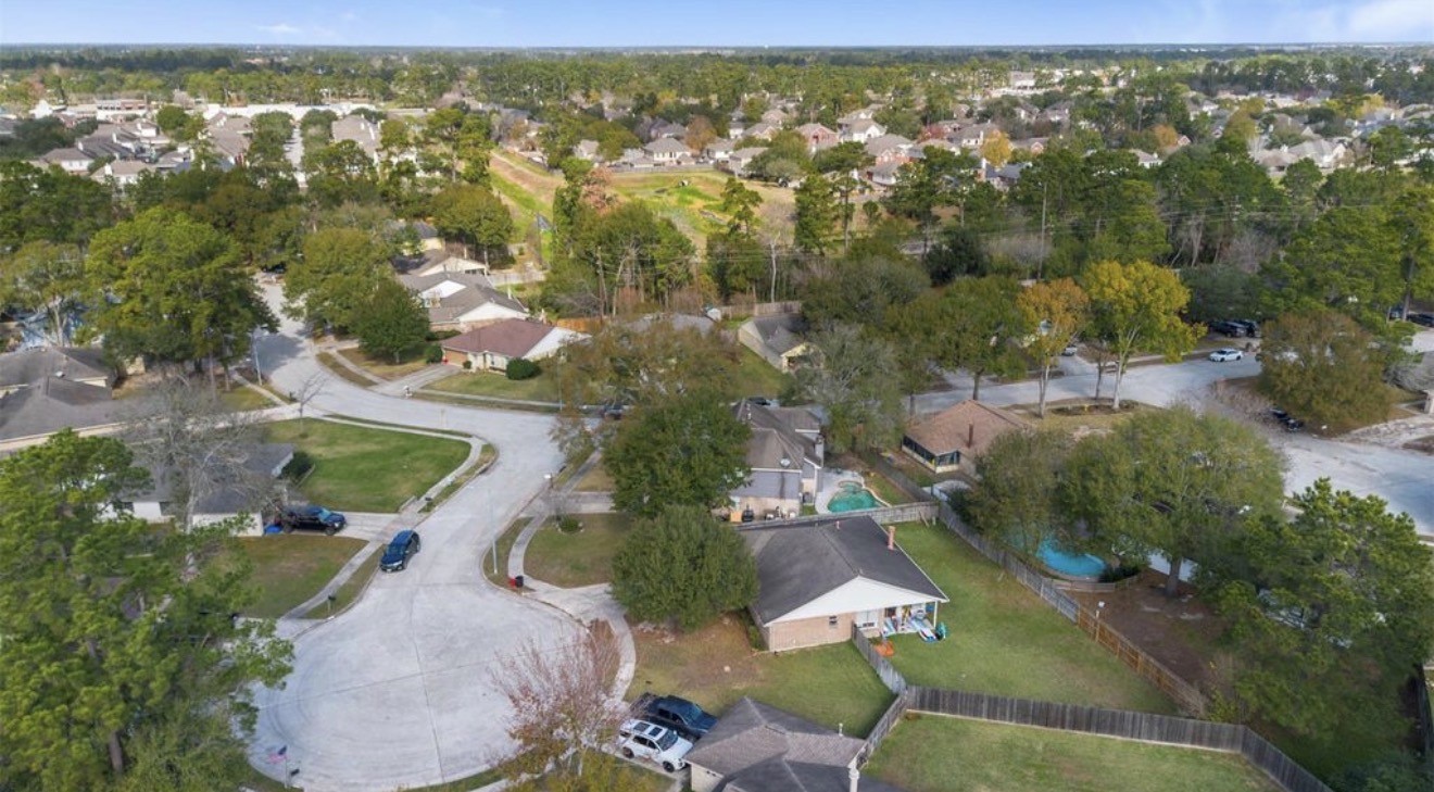 17314 Edenbridge Court Spring, TX 77379 - Photo 31 of 33 an aerial view of residential houses with outdoor space and trees