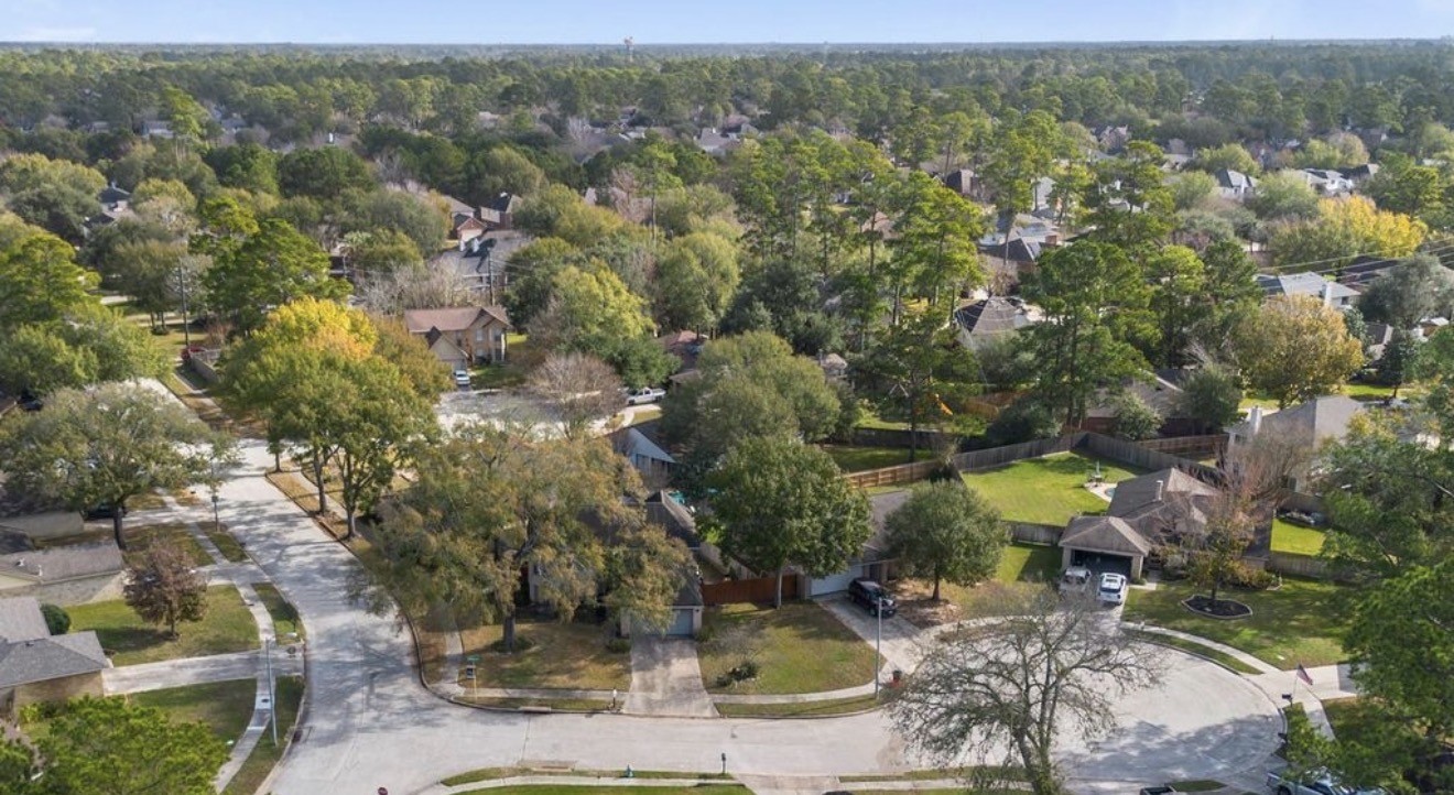 17314 Edenbridge Court Spring, TX 77379 - Photo 32 of 33 an aerial view of residential houses with outdoor space and trees