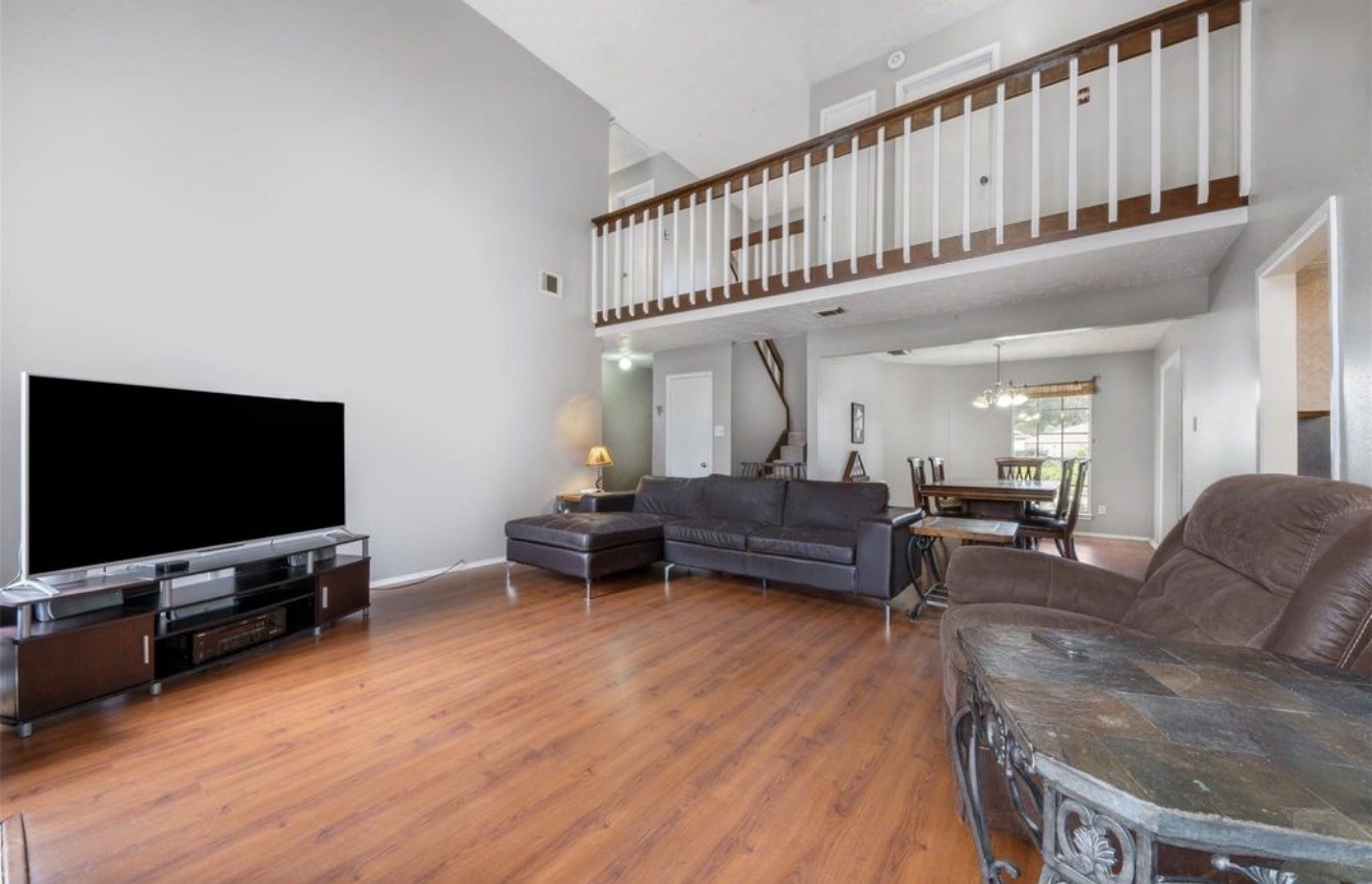 17314 Edenbridge Court Spring, TX 77379 - Photo 10 of 33 a living room with furniture and a flat screen tv