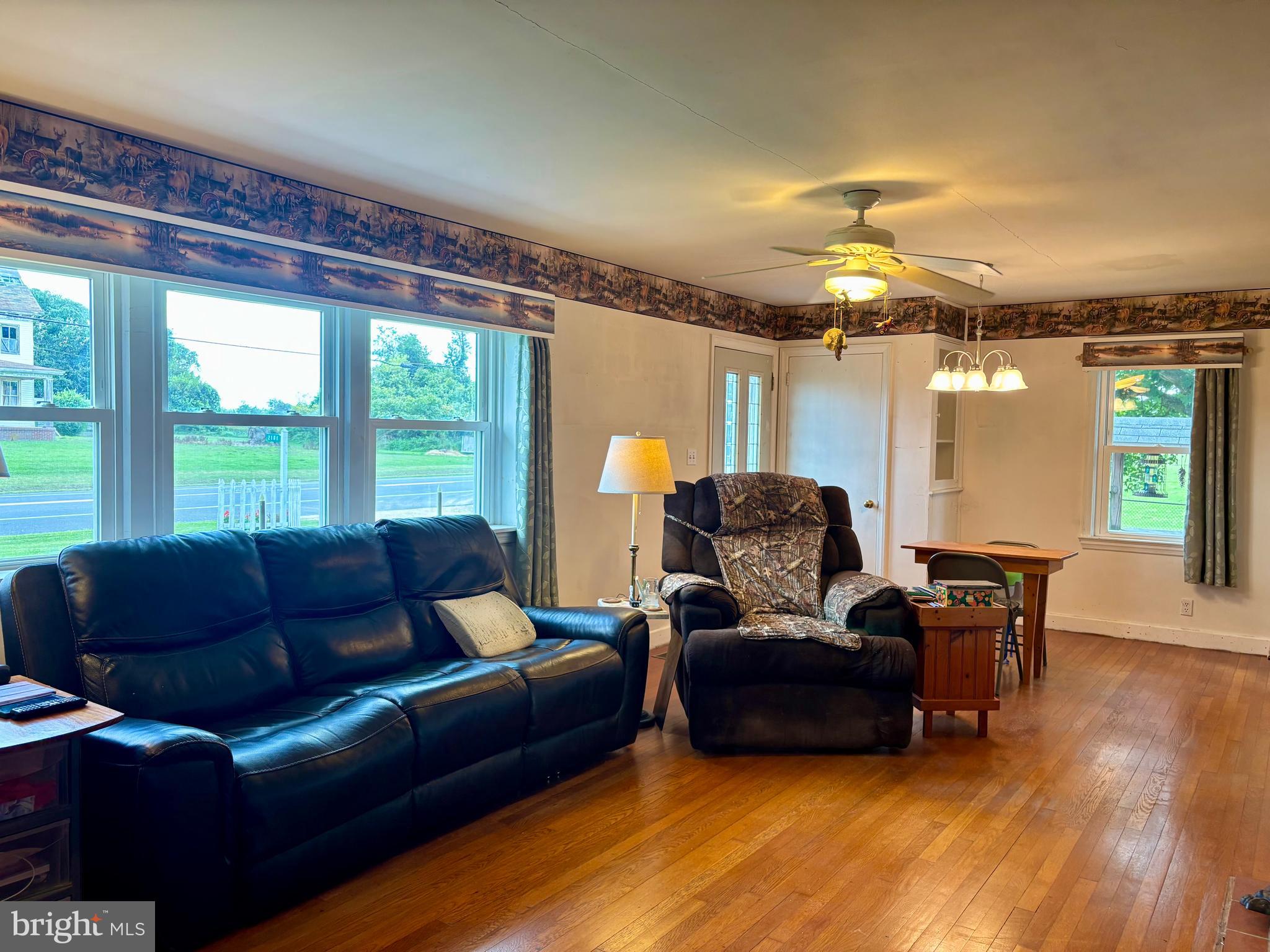 2101 Dudley Corners Road Crumpton, MD 21628 - Photo 13 of 40 a living room with furniture and a large window