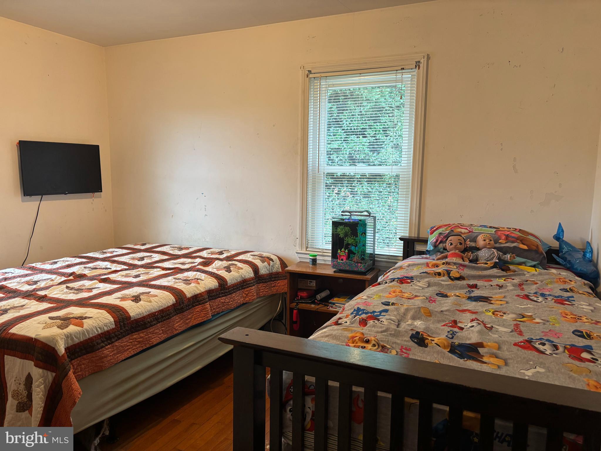 2101 Dudley Corners Road Crumpton, MD 21628 - Photo 16 of 40 a bedroom with a bed and a window