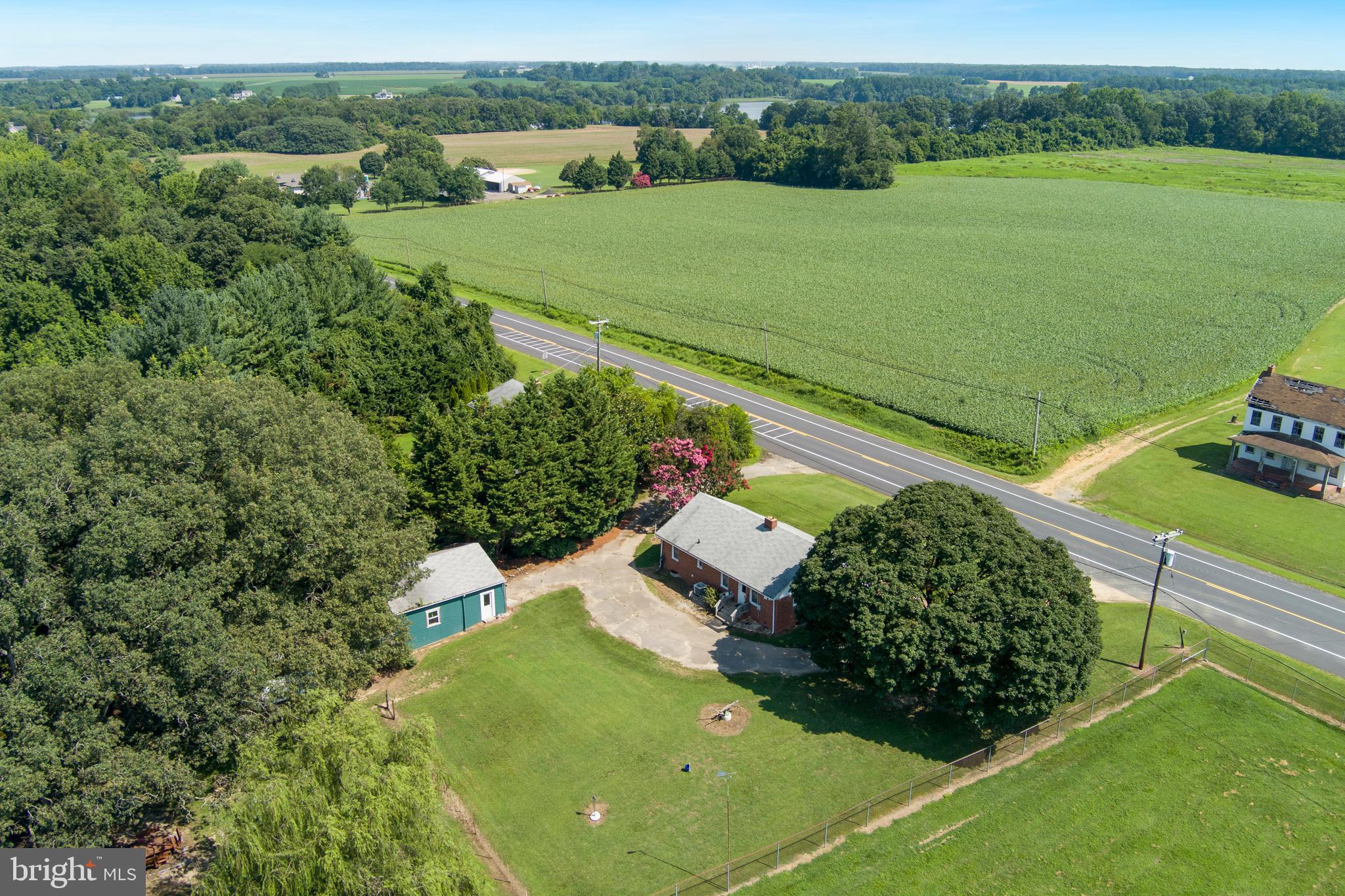 2101 Dudley Corners Road Crumpton, MD 21628 - Photo 33 of 40 an aerial view of a house with a garden and lake view