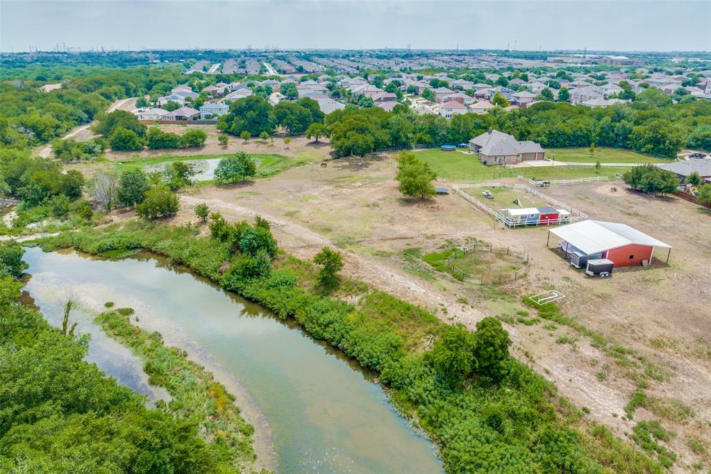 13939 Valley Ranch Road Fort Worth, TX 76262 - Photo 2 of 5 a view of a lake with a city