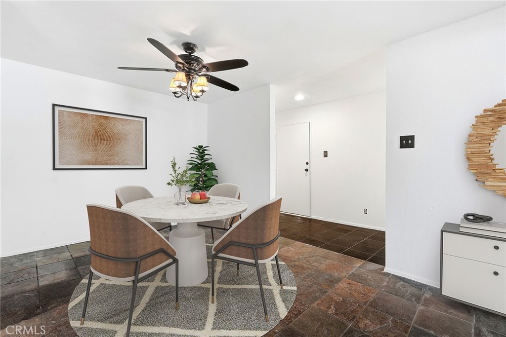 7890 East Spring Street, Unit 11E Long Beach, CA 90815 - Photo 11 of 40 a view of a dining room with furniture