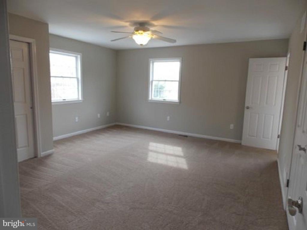 202 Calvert Court Stevensville, MD 21666 - Photo 21 of 30 Large Master Bedroom with Walk-IIn Closet