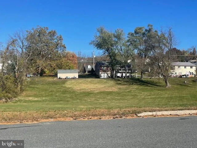 a view of a ocean with a building in the background