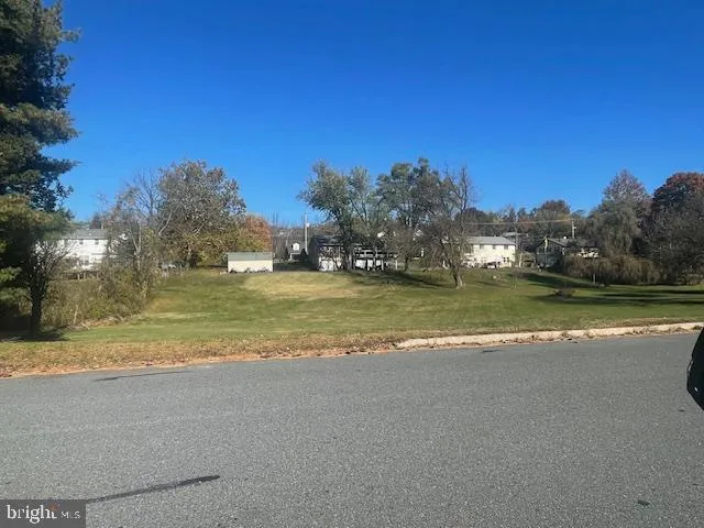 a view of a lake with a building in the background