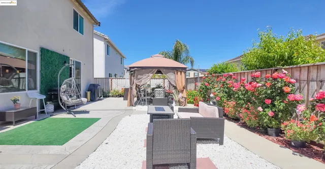 a front view of a house with a porch and a garden