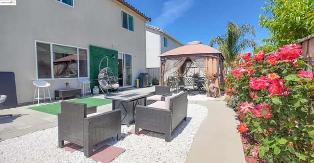 a view of a patio with couches and potted plants