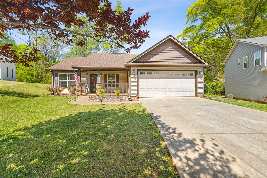 113 Crofton Court Easley, SC 29642 - Photo 1 of 33 This charming home offers a welcoming facade with a well-maintained lawn and convenient garage access.